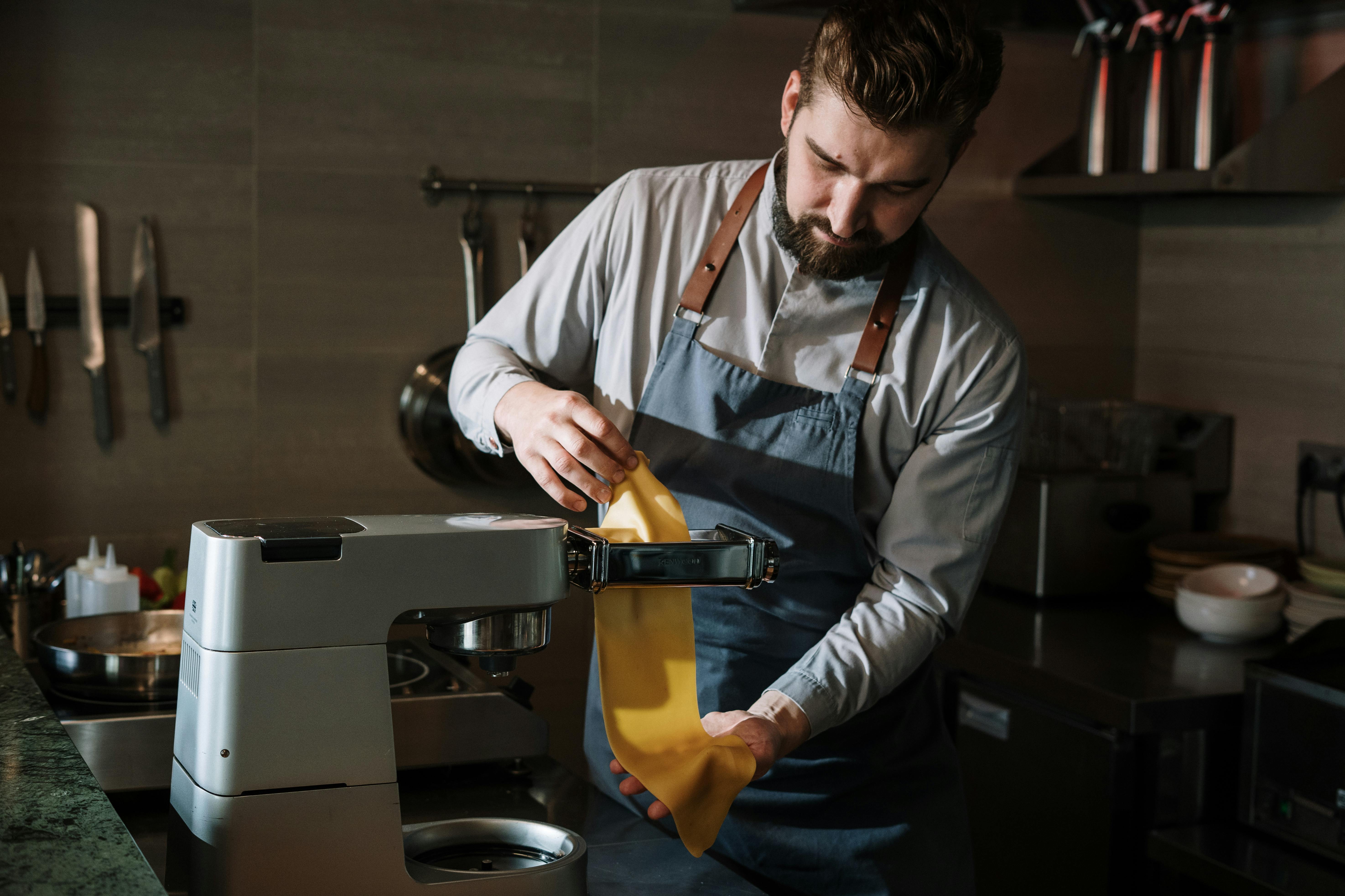 Cooking Pasta, Photo by cottonbro studio: https://www.pexels.com/photo/man-in-blue-dress-shirt-holding-a-yellow-textile-4252772/
